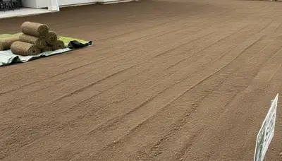 Smooth graded soil ready for sod installation by professional landscapers in Bellevue, WA